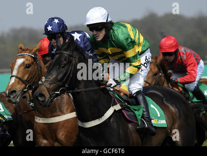 Champion jockey Tony McCoy in action during the bet365 Gold Cup Meeting at Sandown Racecourse, Surrey. Stock Photo