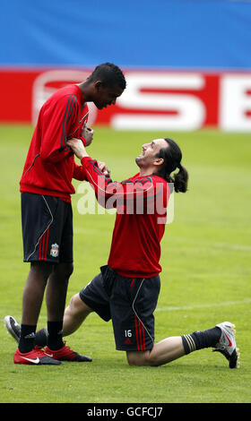 Liverpool's Damien Plessis and Sotirios Kyrgiakos (right) enjoy a lighter moment during the training session at the Vicente Calderon Stadium, Madrid, Spain. Stock Photo