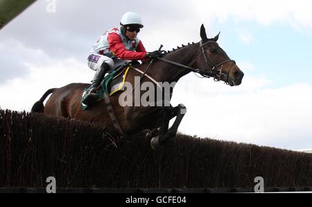 Olli Magern ridden by Paddy Brennan jumps during The Getyourbetson@Stanjames.com Festival Steeple Chase during the Stan James Perth Festival at Perth Racecourse, Scotland. Stock Photo