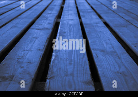 Rough blue light grayish bluish indigo wooden stage background with low depths of field Stock Photo