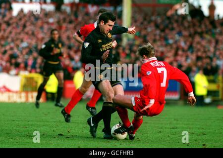 Manchester United's Eric Cantona tangles with Swindon Town's John Moncur in an incident that led to Cantona's sending off Stock Photo