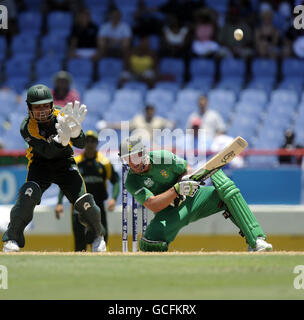 South Africa's AB De Villiers is caught by Pakistan wicketkeeper Kamran Akmal (left) after attempting an over the head shot during the Super Eights match at Beausejour Stadium, St Lucia. Stock Photo