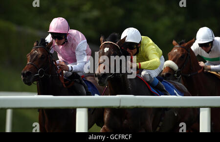 Horse Racing - Ladies Day - Chepstow Racecourse. Caucus ridden by Steve Drowne (Left) on their way to victory in the Pimm's Maiden Stakes during Ladies Day at Chepstow Racecourse. Stock Photo