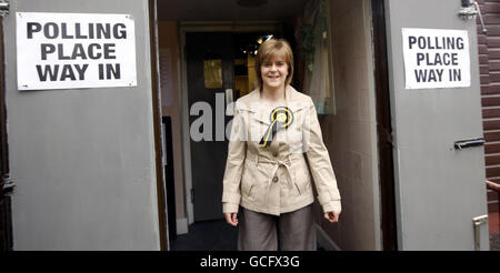 SNP deputy leader Nicola Sturgeon leaves Broomhouse Community Hall polling station in Glasgow East after casting her vote. Stock Photo