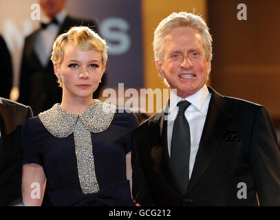 Carey Mulligan and Michael Douglas depart after the screening of Wall Street: Money Never Sleeps at the Grand Auditorium Lumiere during the Cannes Film Festival, France. Stock Photo