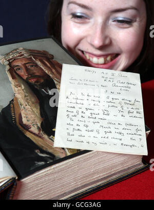Books Specialist at Lyon and Turnbull Auctions, Alex Dove, with a lost letter from Lawrence of Arabia describing his experiences at an RAF base in Lincolnshire and a rare copy of his book The Seven Pillars Of Wisdom. Stock Photo