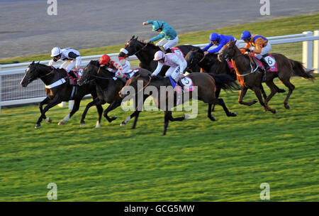 Fallen Idol ridden by William Buick (number 5) wins The Britain's Got Talent Bingo at Meccabingo.com Heron Stakes at Sandown Racecourse, Sandown. Stock Photo