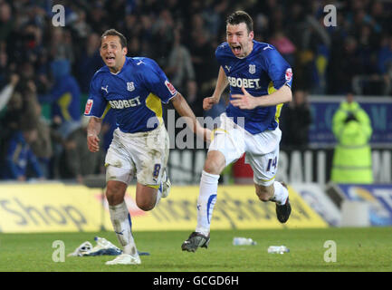 Cardiff City's Michael Chopra (left) and Paul Quinn (right) celebrate after beating Leicester City on penalties during the Coca Cola Championship Play Off, Semi Final, Second Leg match at Cardiff City Stadium, Cardiff. Stock Photo