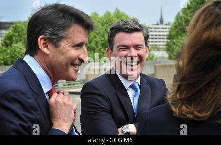 London 2012 chairman Lord Coe (left) with Olympics minister Hugh Robertson pose on London's Southbank as they promote the launch of the London 2012 Olympics Torch Relay. Stock Photo