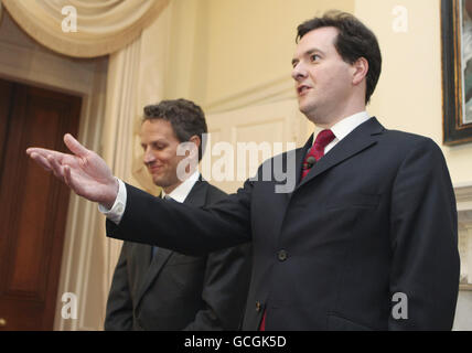 Britain's Chancellor of the Exchequer George Osborne, right, listens as U.S. Treasury Secretary Timothy Geithner speaks at a joint press conference at 11 Downing Street, in London, U.K. Stock Photo