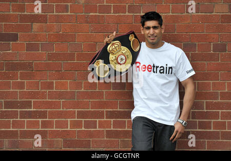 Boxing - Amir Khan Press Call - Gloves Community Centre. Amir Khan with his WBA light-welterweight belt during a photo call at The Gloves Community Centre, Bolton. Stock Photo