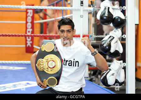 Boxing - Amir Khan Press Call - Gloves Community Centre. Amir Khan with his WBA light-welterweight belt during a photo call at The Gloves Community Centre, Bolton. Stock Photo