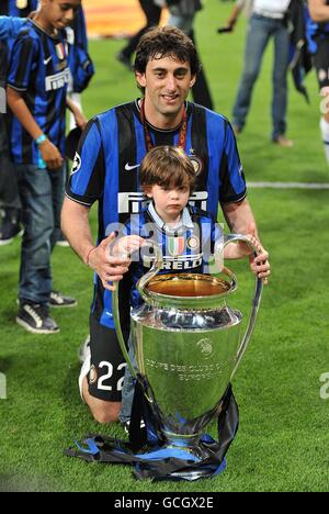 Inter Milan's Diego Milito celebrates with his son and the UEFA Champions League trophy Stock Photo