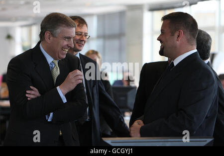 The Duke of York (left) laughs during a visit to Spatial, a Computer Software firm in Cambridge, Cambridgeshire. Stock Photo