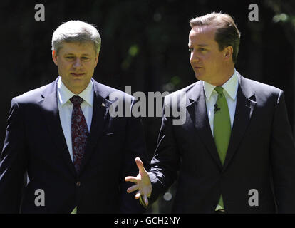 Britain's Prime Minister David Cameron and his Canadian counterpart Prime Minister Stephen Harper during a news conference in the garden of 10 Downing Street, London. Stock Photo