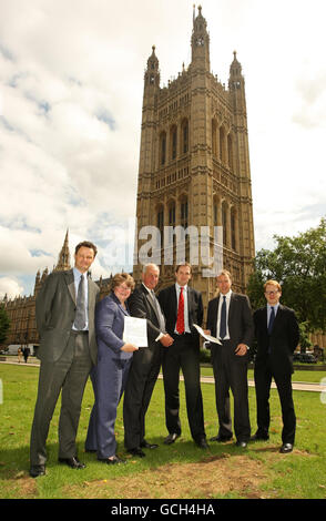 Suffolk MPs (left to right) MP for Waveney Peter Aldous, MP for Suffolk Coastal Therese Coffey, MP for South Suffolk Tim Yeo, MP for Central Suffolk and North Ipswich Dr Dan Poulter, MP for West Suffolk Matthew Hancock, and MP for Ipswich Ben Gummer, who are calling for the restoration of a fair funding formula for the county on issues such as health, education and transport, outside the Houses of Parliament, Westminster, London. Stock Photo
