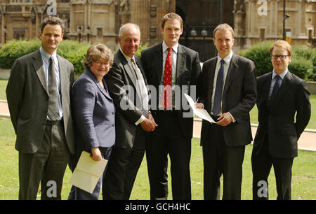 Suffolk MPs (left to right) MP for Waveney Peter Aldous, MP for Suffolk Coastal Therese Coffey, MP for South Suffolk Tim Yeo, MP for Central Suffolk and North Ipswich Dr Dan Poulter, MP for West Suffolk Matthew Hancock, and MP for Ipswich Ben Gummer, who are calling for the restoration of a fair funding formula for the county on issues such as health, education and transport, outside the Houses of Parliament, Westminster, London. Stock Photo