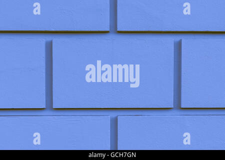 Perfect blue yellowish brownish indigo high resolution natural urban brick wall background with shadows Stock Photo
