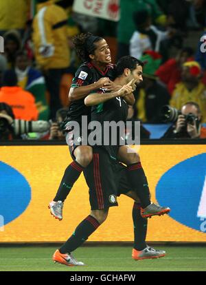 Mexico's Rafael Marquez (right) celebrates scoring his sides first goal of the game with teammate Dos Santos Giovani (left) Stock Photo