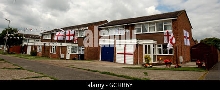 A row of houses in Housman Avenue, Royston, Hertfordshire, are decorated with England flags as football fans across the country prepare for England's first world cup match against the USA. Stock Photo