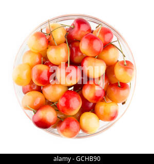Rainier Cherries in a bowl, isolated on white and viewed from above. Stock Photo