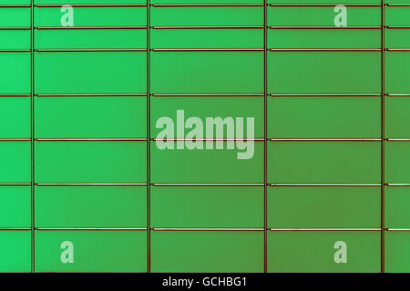 light dark green reddish greenish colored post boxes background of even and symmetrical structure serves as decent board Stock Photo