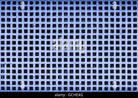old blue light grayish bluish indigo cellar security grid window with white paint Stock Photo