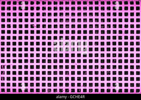 old purple pink or purplish pinkish violet cellar security grid window with white paint Stock Photo