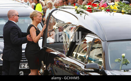 Mourners pay their respects as the hearse containing the coffin of Private Douglas Halliday makes it's way through Wootton Bassett high street, during the repatriation of seven British servicemen, who were killed in Afghanistan. Stock Photo