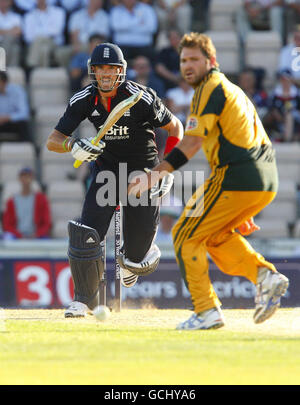 England's Kevin Pietersen hits four runs off the bowling of Australia's Ryan Harris (right) during the First Natwest One Day International match at the Rose Bowl, Southampton. Stock Photo