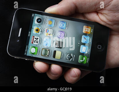 A customer holds his new iPhone outside the Apple store on Buchanan Street in Glasgow as the iPhone 4 goes on sale across the UK. Stock Photo