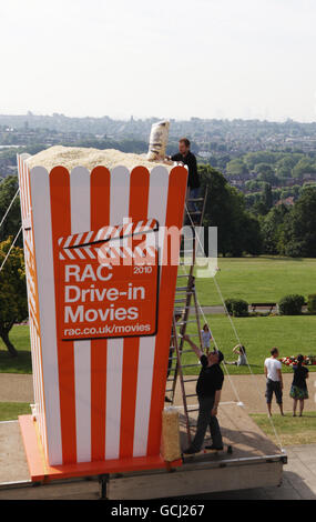 As temperatures top 30 degrees celcius, the Worlds biggest popcorn box is delivered to Alexandra Palace ahead of the RAC Drive-In Movie season taking place at Alexandra Palace and Weston Park this summer. The RAC Drive- In Movie Popcorn box measures a staggering 17 feet high, 8 feet wide and carries over a million popcorn kernels which equates to over a ton of popcorn. Stock Photo