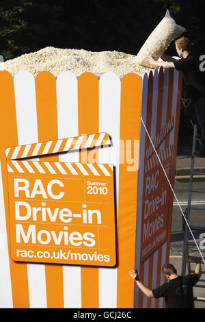 As temperatures top 30 degrees celcius, the Worlds biggest popcorn box is delivered to Alexandra Palace ahead of the RAC Drive-In Movie season taking place at Alexandra Palace and Weston Park this summer. The RAC Drive- In Movie Popcorn box measures a staggering 17 feet high, 8 feet wide and carries over a million popcorn kernels which equates to over a ton of popcorn. Stock Photo