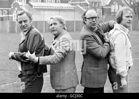 Comedians Eric Morecambe and Ernie Wise in the Hammersmith grounds of Euston Films today, where they teamed up with tough crimebusters Carter and Regan of 'The Sweeney' Fame. Inspector Regan, actor John Thaw (left) and Det Sgt Carter, actor Dennis Waterman appeared as gusts on a Morecambe and Wise Christmas show in 1976. They joked they would only appear if Eric and Ernie agreed to appear in their show, and now the quartet will play in The Sweeney: 'Hearts and Minds' an episode of the next series on ITV. Stock Photo