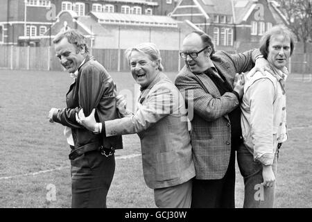 Comedians Eric Morecambe and Ernie Wise in the Hammersmith grounds of Euston Films today, where they teamed up with tough crimebusters Carter and Regan of 'The Sweeney' Fame. Inspector Regan, actor John Thaw (left) and Det Sgt Carter, actor Dennis Waterman appeared as gusts on a Morecambe and Wise Christmas show in 1976. They joked they would only appear if Eric and Ernie agreed to appear in their show, and now the quartet will play in The Sweeney: 'Hearts and Minds' an episode of the next series on ITV. Stock Photo