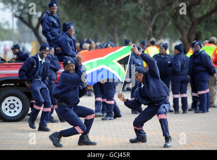 Police Officers Wave A South African Flag Following A Passing Out 