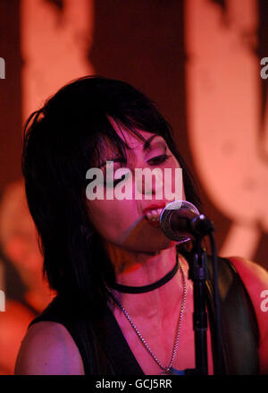 Joan Jett of Joan Jett and the Blackhearts, performing on stage at The 100 Club in central London. Stock Photo