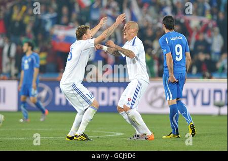 Soccer - 2010 FIFA World Cup South Africa - Group F - Slovakia v Italy - Ellis Park. Slovakia's Jan Durica (centre left) and Martin Skrtel (centre right) celebrate victory after the final whistle Stock Photo