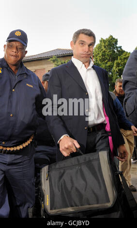 Sunday Mirror journalist Simon Wright (right) leaves Cape Town Magistrates after his case of charges of defeating the ends of justice and flouting the immigration act was adjourned until July 7, Cape Town, South Africa. PRESS ASSOCIATION Photo. Picture date: Wednesday June 30, 2010. England fan Pavlos Joseph, 32, from Crystal Palace gave an interview to the Sunday Mirror who walked into the team's dressing room after the World Cup match against Algeria. See PA story WORLDCUP England Security. Photo credit should read: Anthony Devlin/PA Wire Stock Photo