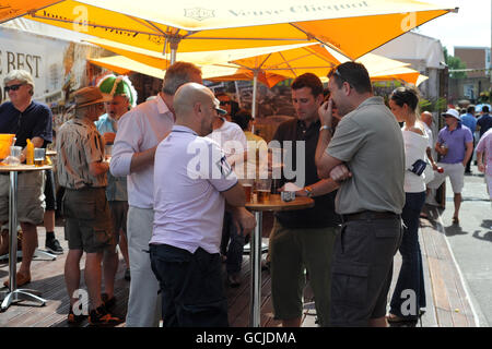 Guests enjoy one of the outside bars at the Brit Oval Stock Photo