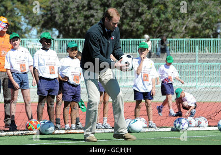 Prince William plays in goal during a visit to the Coaching for Conservation project in Maun, Botswana. Stock Photo