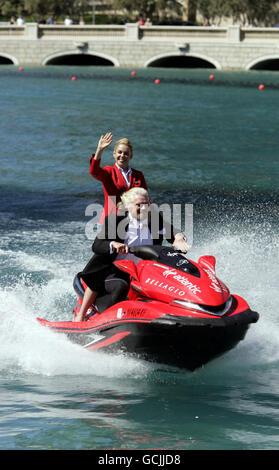 Sir Richard Branson rides a jet ski with stewardess Vicky Lewis in the fountain of the Bellagio Hotel in Las Vegas, USA. Stock Photo