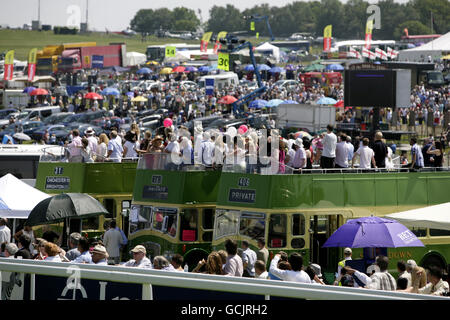 Horse Racing - Investec Derby Festival - Ladies Day - Epsom Racecourse. Racegoers enjoy themselves on double decker buses during Ladies Day at Epsom Downs Racecourse, Surrey. Stock Photo