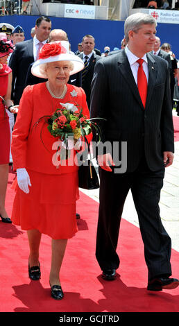 Queen Elizabeth II with Stephen Harper the Prime Minister of Canada outside the Parliament Building after arriving to attend the Canada Day celebrations, in Ottawa, Canada. Stock Photo