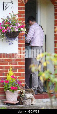 A taxi driver delivers flowers to a woman at the home of Alex Chapman, the former husband of alleged Russian spy Anna Chapman in the New Forest. Stock Photo