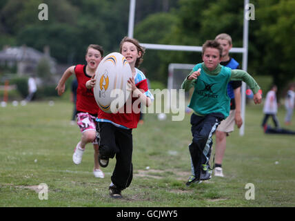Rugby Union - Street Rugby - Lochgoilhead Green. Children take part during Street Rugby on The Green in Lochgoilhead, Scotland. Stock Photo