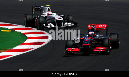 Motor Racing - Santander British Formula One Grand Prix - Race Day - Silverstone Circuit. Vodafone McLaren Mercedes' Jenson Button (right) during the Santander British Grand Prix at Silverstone Circuit, Northampton. Stock Photo