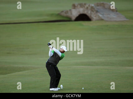 Tiger Woods hits his tee shot on the 15th hole during the first round ...