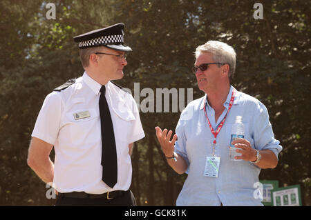 Superintendent Ian Sidney (left) from the Suffolk Constabulary with Latitude Festival organiser Melvin Benn after their press conference concerning the assaults at the festival on Thursday and Friday, in Henham Park, Southwold, Suffolk. Stock Photo