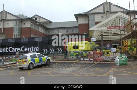 Police officers at the scene in the car park of Blackpool Victoria Hospital where nurse Jane Clough was stabbed to death last night. Stock Photo